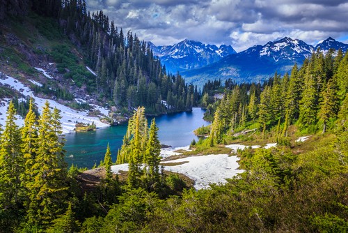 In Montana's Rocky Mountains, Glacier National Park is a 1,583 square mile wilderness region with glacier-carved peaks and valleys that extend to the Canadian border.