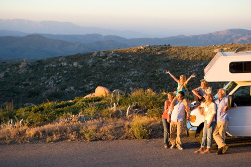 Family next to an RV excited