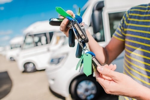 Man with keys to an RV