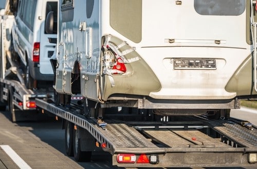 RV being hauled away due to maintenance issues